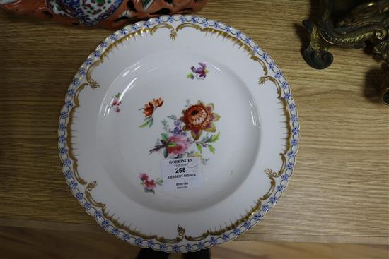 A small collection of decorative floral painted dessert dishes